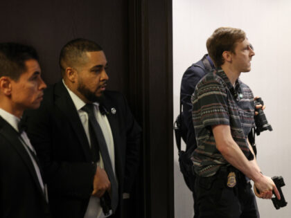 Members of law enforcement respond during the White House Correspondents Dinner, Saturday,