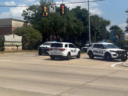 Law enforcement personnel respond to reports of a shooting at Mall of Louisiana in Baton R