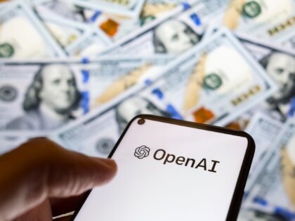 The OpenAI logo appears on a smartphone screen, while dollar bills are displayed in the ba