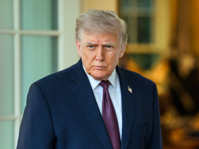 President Donald J. Trump accepts a DoorDash delivery from Sharon Simmons outside of the O