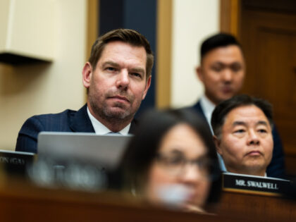 Rep. Eric Swalwell (D- CA), left, listens to former Special Counsel Jack Smith testifies d