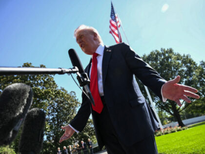 US President Donald Trump talks to the press before boarding Marine One as he departs from