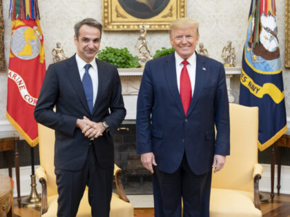 Greek Prime Minister Kyriakos Mitsotakis (L) meets U.S. President Donald Trump (C) in the