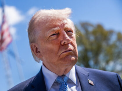 President Donald Trump talks with reporters on the South Lawn during the White House Easte