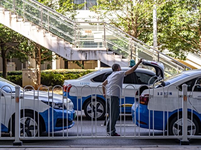 Taxis wait for fares outside the airport in Wuhan, China, on Sunday, July 21, 2024. More t