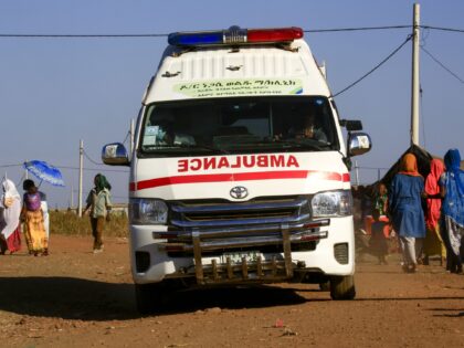 An ambulance drives in a border reception centre (Village 8), housing Ethiopian refugees w