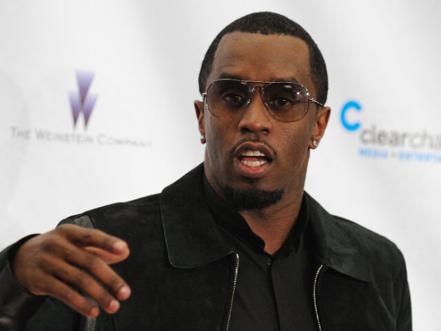Sean "Diddy" Combs, Entrepreneur stands for a photograph at the 121212 concert