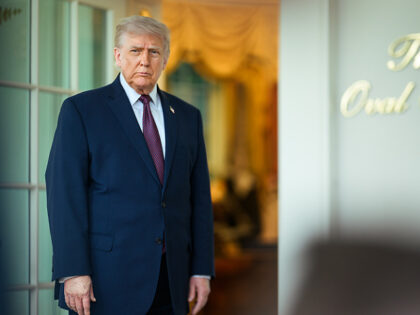President Donald J. Trump accepts a DoorDash delivery from Sharon Simmons outside of the O