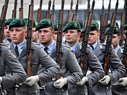 German soldiers of an honor guard march as preparations are under way for an official welc