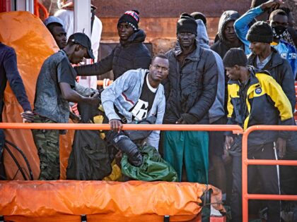 Migrants disembark after being rescued at sea by a Spanish Salvamento Maritimo (Sea Search