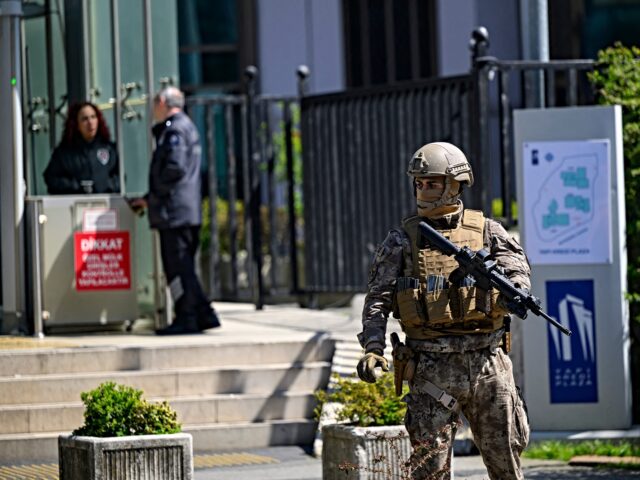 A police official stands alert near The Israeli Consulate in Istanbul on April 7, 2026, fo