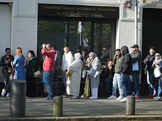 BILBAO, BASQUE COUNTRY, SPAIN - APRIL 20: Several people queue at the Consulate General of
