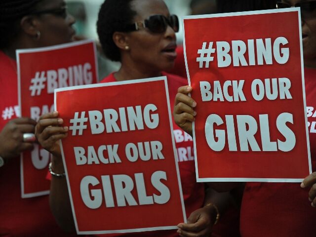 Nigerian women living in Kenya demonstrate to press for the release of Nigerian school gir