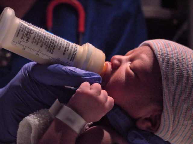 Newborn Baby Feeding with Bottle in Hospital