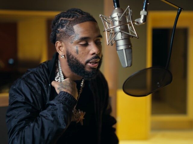 DOJ: Rapper Pooh Shiesty, Wearing an Ankle Monitor & Accompanied by His Father, Held Music Exe