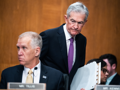 Federal Reserve Chairman Jerome Powell, right, and Sen. Thom Tillis (R-NC), arrive for the