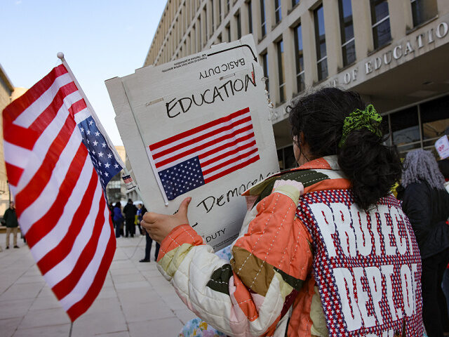 Demonstrators gather outside of the offices of the U.S. Department of Education in Washing