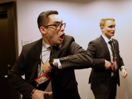 Secret service agents respond during the White House Correspondents Dinner, Saturday, Apri