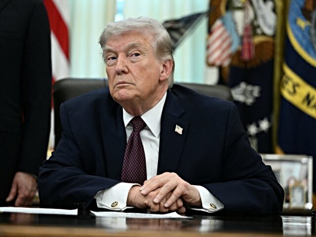 US President Donald Trump takes a question from a reporter after signing an executive orde