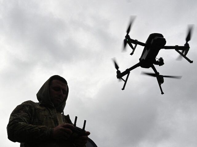 TOPSHOT - A Ukrainian serviceman operates a drone during the 'Wild Drones' drone