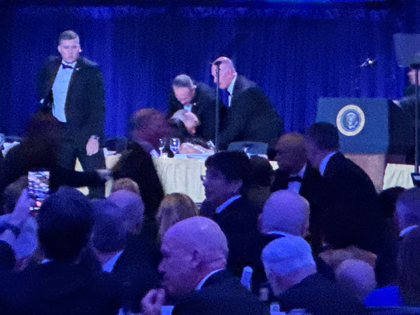 Secret service agents respond during the White House Correspondents Dinner, Saturday, Apri