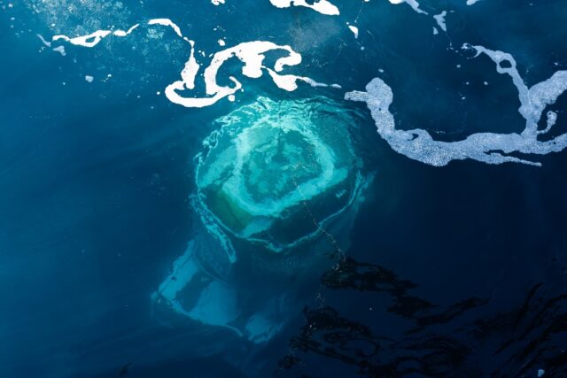 Archeologists use a remote-controlled robot with pincers and cameras to plunge to more tha