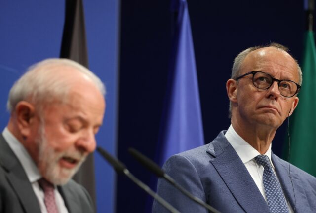 Brazilian President Luiz Inacio Lula da Silva (L) and German Chancellor Friedrich Merz (R)