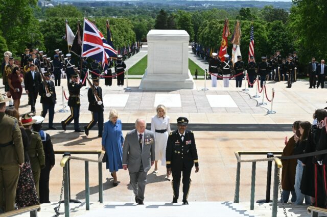 Britain's King Charles III and Queen Camilla following a wreath-laying ceremony at th