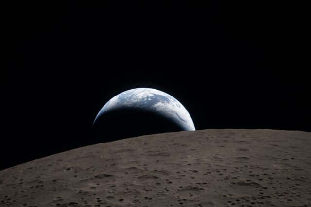 This handout picture released on April 7, 2026, by NASA shows Earth as it dips beyond the