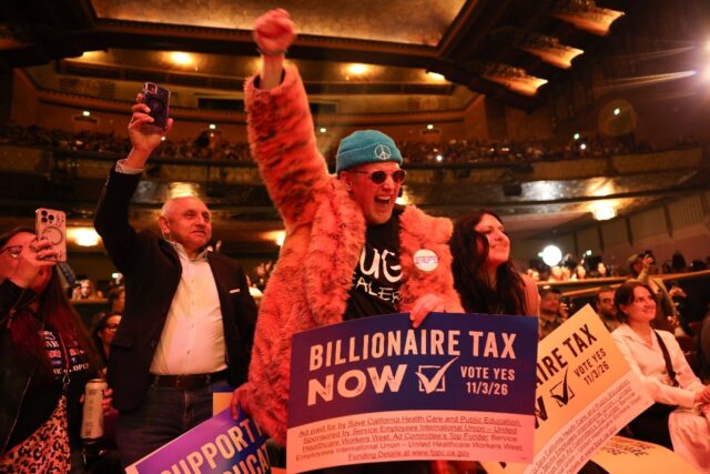 People chant in support of a tax on billionaires during a Bernie Sanders rally in Los Ange