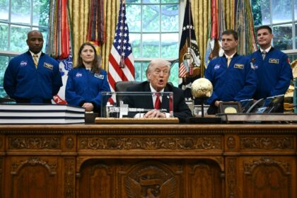 US President Donald Trump speaks as he welcomes the Artemis II astronauts, from L to R, Vi