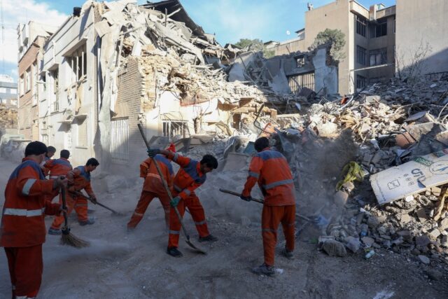 Workers respond to Israeli-US strikes that destroyed the Rafi-Nia Synagogue and nearby res