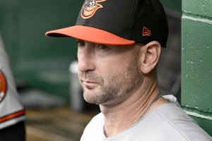 Baltimore Orioles manager Craig Albernaz OK after line drive hits face