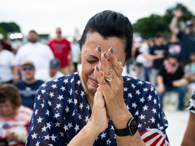 WASHINGTON, DC - MAY 17: An attendee prays during Rededicate 250: A National Jubilee of Pr