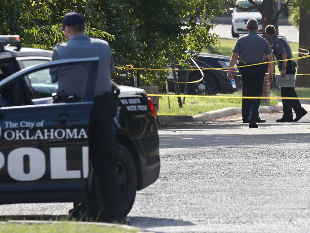 Crime scene tape closes off an area where a shooting suspect was fatally shot during a pol