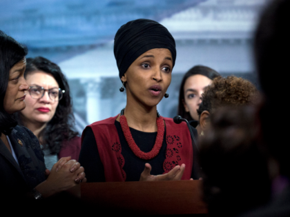 FILE - Congressional Progressive Caucus members Rep. Ilhan Omar, D-Minn., center accompani
