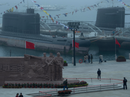 Visitors look at retired submarines at the Chinese People's Liberation Army Naval Mus