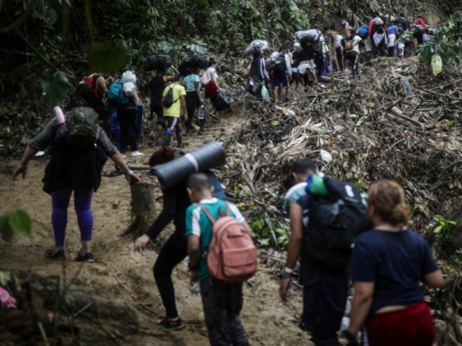 FILE - Migrants walk across the Darien Gap from Colombia to Panama in hopes of reaching th
