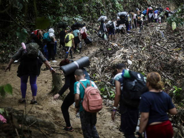 AP25105585033956 FILE - Migrants walk across the Darien Gap from Colombia to Panama in hopes of reaching th
