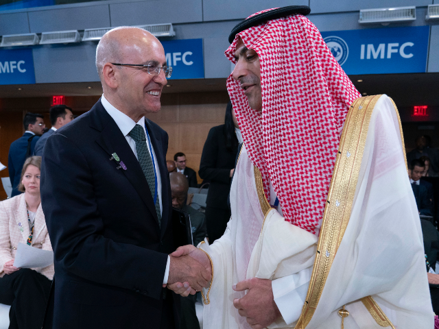 AP25115612832187 Turkey's Finance Minister Mehmet Şimşek, left, shake hands with Governor of the Sau