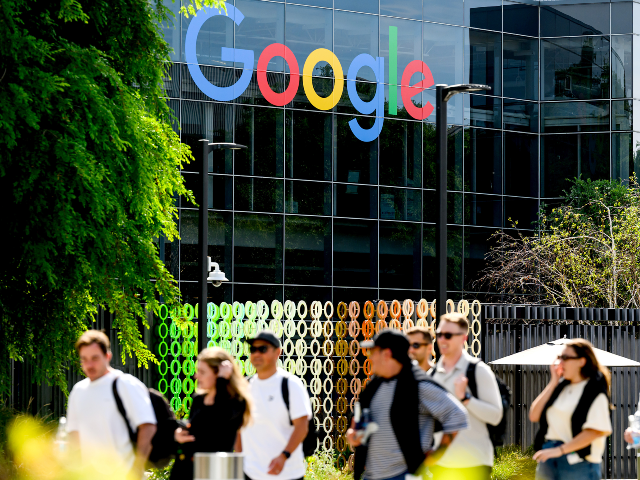 AP26085849451102 People walk through Google headquarters in Mountain View, Calif., on Thursday, March 26, 2