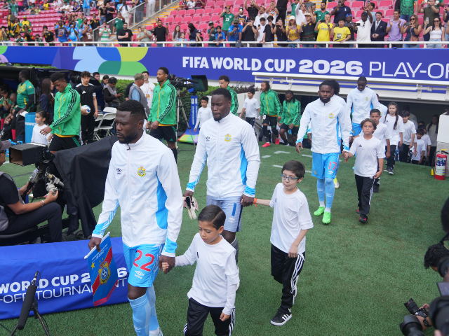 Players enter to the pitch prior to the World Cup playoff final soccer match between DR Co