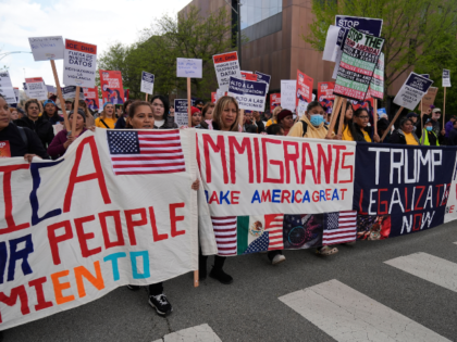 FILE - Thousands of people march in a May Day rally and protest May 1, 2025, in Chicago. (