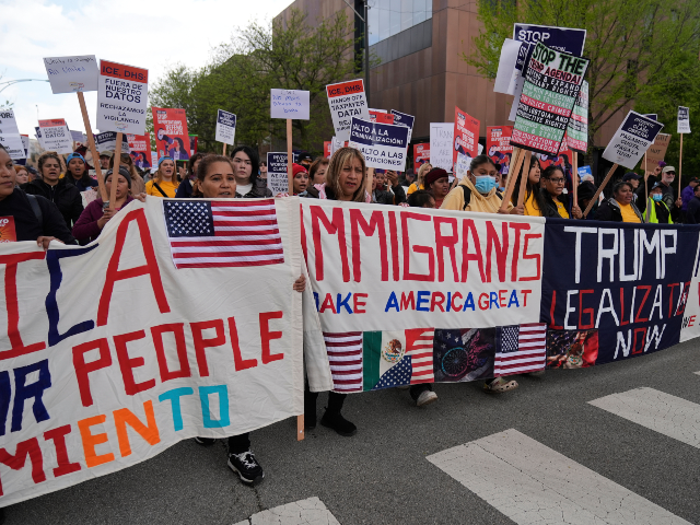FILE - Thousands of people march in a May Day rally and protest May 1, 2025, in Chicago. (
