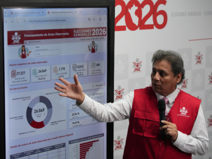 Jorge Valdivia, a spokesman for Peru's National Jury of Elections, shows vote-count r