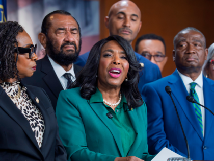 FILE—Rep. Terri Sewell, D-Ala., center, is surrounded by members of the Congressional Bl