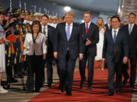 Beijing Rolls Out the Red Carpet for Trump: Bright Lights and Hundreds of Children Greet President 