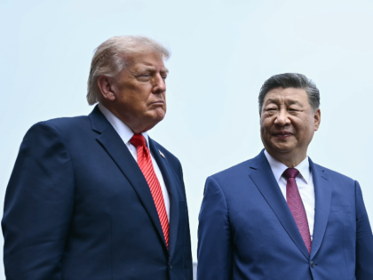 China's President Xi Jinping, right, and U.S. President Donald Trump visit the Temple