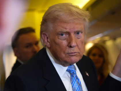 President Donald Trump speaks to reporters aboard Air Force One, Friday, May 15, 2026, as