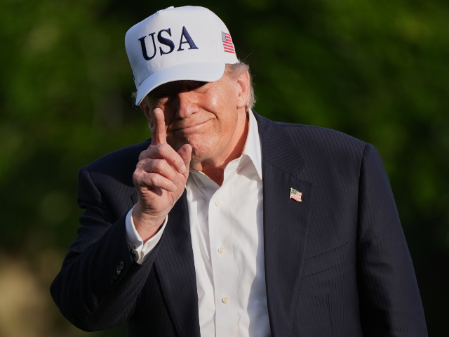 AP26135832932963 President Donald Trump gestures to reporters as he walks across the South Lawn of the Whit